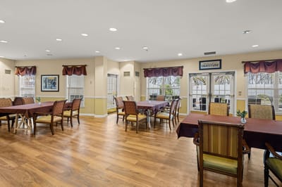 Dining area with tables and chairs for residents