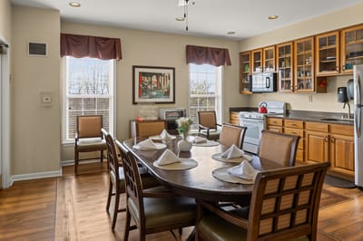 Dining area with a large table set for meals