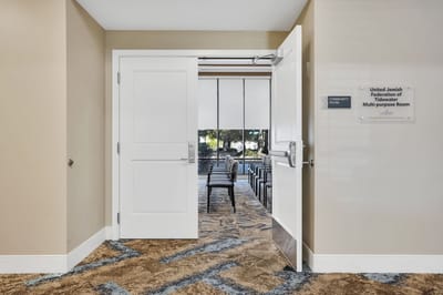 Entrance to a community room with empty chairs