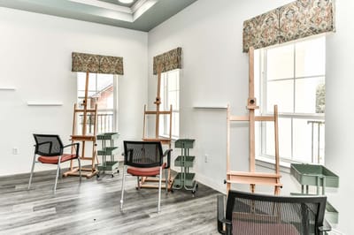 Art studio space with easels and stools