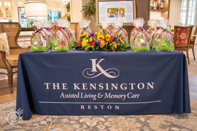 Decorated table for a community event with logo.