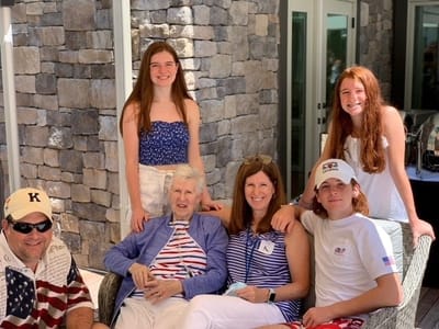 Family gathering with residents and staff outdoors