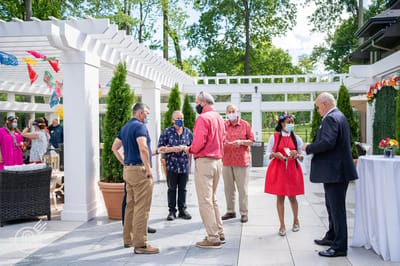 Residents and staff mingling in an outdoor area