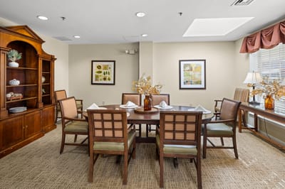Bright dining room setup with a round table and chairs