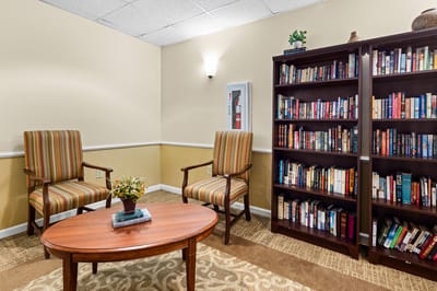 Cozy reading nook with bookshelves and seating
