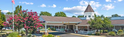 Exterior view of the TerraBella Salem building with gardens