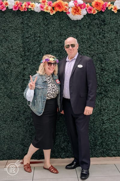 Two staff members posing at a celebration event