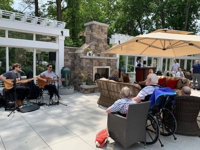 Residents enjoying live music outside in a garden