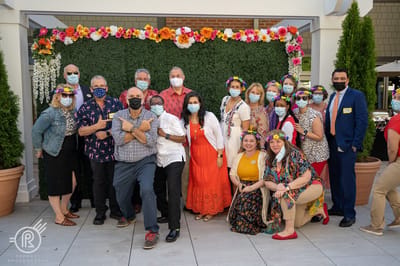 Staff and residents posing for a group photo during an event