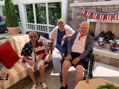 Residents enjoying a celebration in a garden area