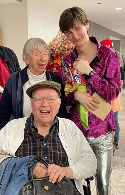 Residents and staff celebrating together in the facility.