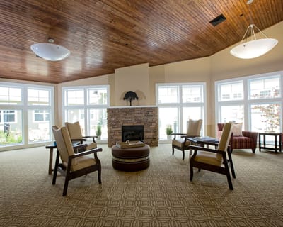 Bright common area with comfortable seating and fireplace