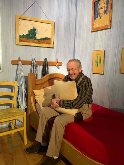 Resident smiling in an interior bedroom setting