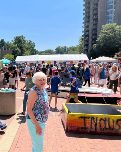 Residents and families enjoying a community event outdoors