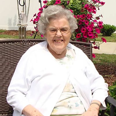 Smiling resident enjoying the garden area