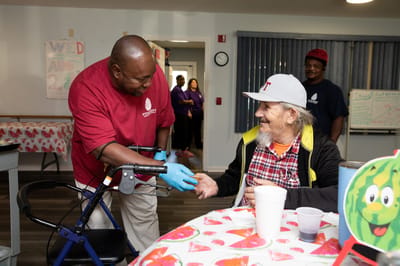 Caregiver interacting with a resident in a common area