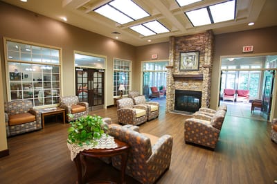 Bright common area with comfortable seating and fireplace