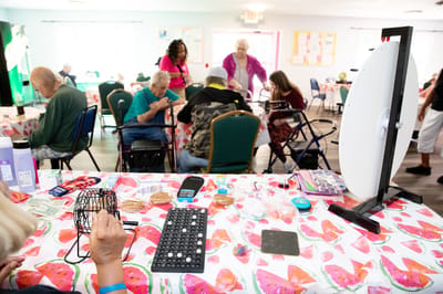 Residents engaging in a bingo activity in a common area