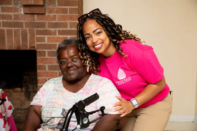 Staff member with resident inside the facility