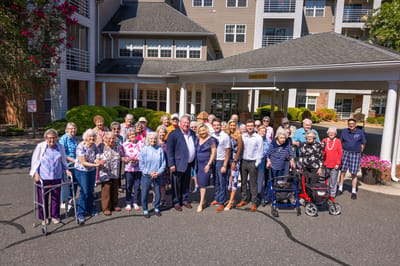 Residents and staff gathered outside the facility