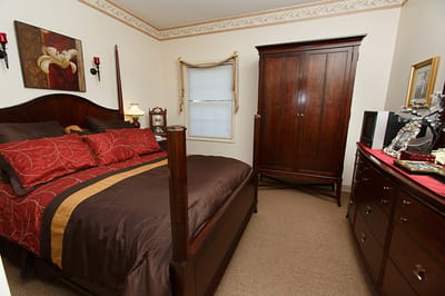 Cozy private room with a bed and wardrobe