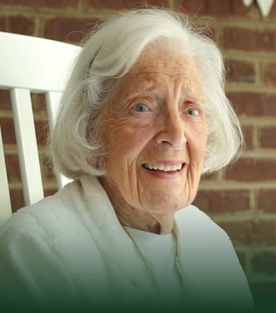 Senior resident smiling in a cozy setting