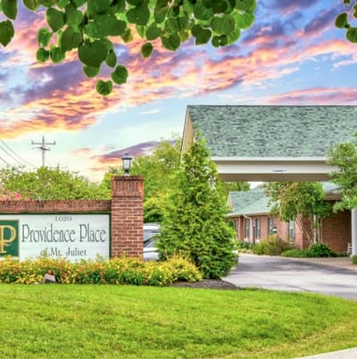 Exterior view of Providence Place with a sunset sky