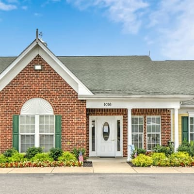 Exterior view of a senior living facility with landscaping
