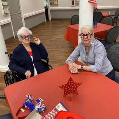 Residents celebrating with festive decor in a common area