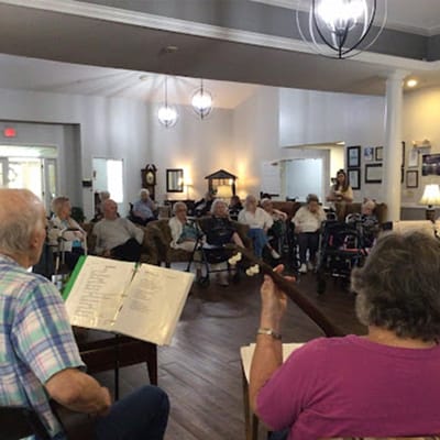 Residents enjoying a music activity in a common area