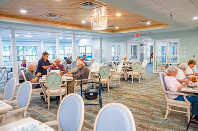 Residents enjoying a meal in a dining room