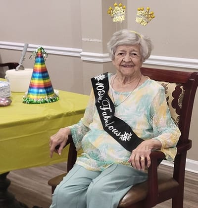 Resident celebrating a milestone birthday in a common area