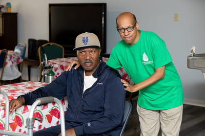 Two residents interacting in a common area