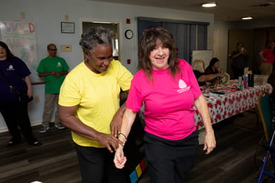 Residents participating in an activity in a lively common area