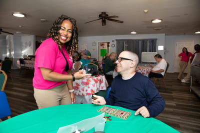 Residents enjoying a bingo activity in a common area