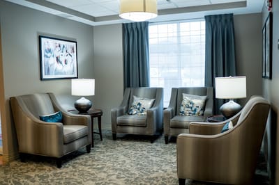 Cozy lounge area with chairs and lamps