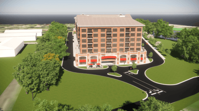 Aerial view of a modern assisted living facility with landscaped gardens