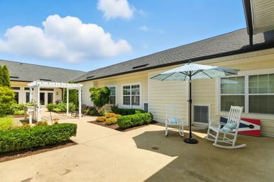 Outdoor patio area with seating and garden