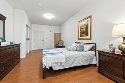 Private resident room with a bed and furniture