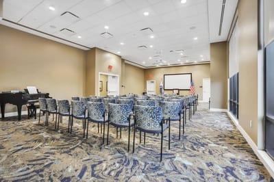 Interior view of a large meeting room with chairs