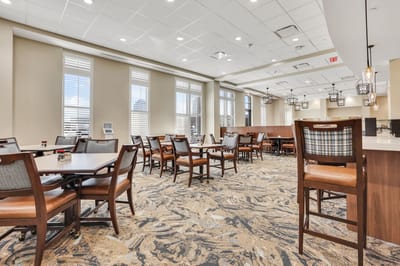 Bright and inviting dining area with tables and chairs