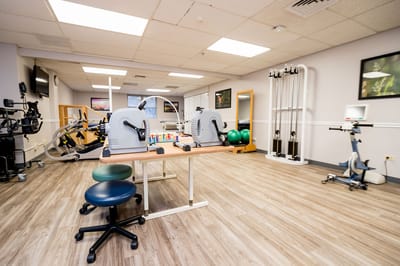Interior view of a therapy room with exercise equipment