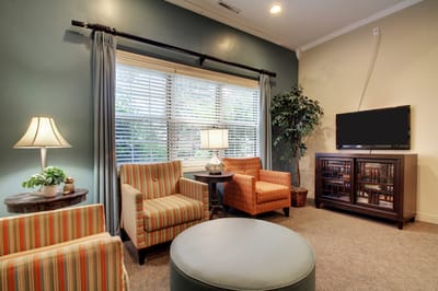 Cozy common area with seating and a television