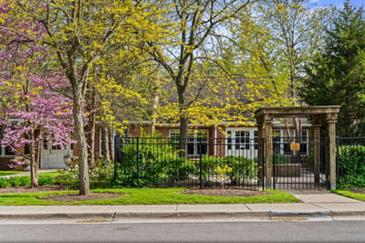 Exterior view of Serenity Estates with blooming trees