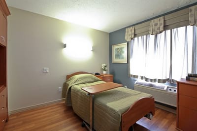 Cozy resident room with a bed and furniture