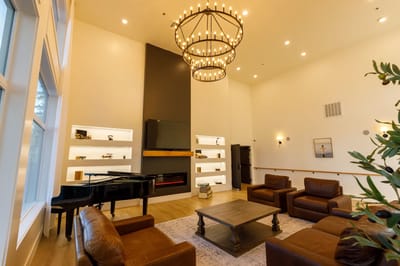 Cozy common area with comfortable seating and a piano