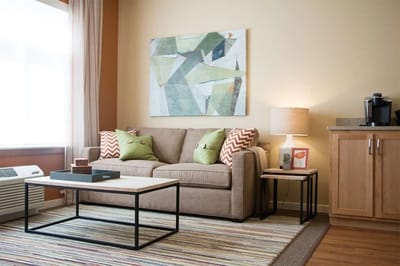 Cozy living area with couch and artwork