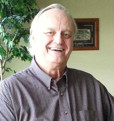 Smiling man in a comfortable indoor setting