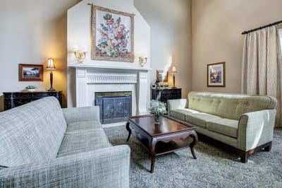 Cozy living room with comfortable seating and a fireplace