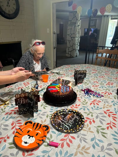 Resident celebrating a birthday with cake